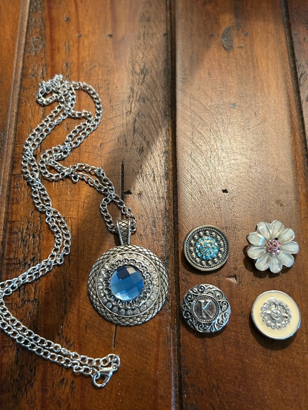 Silver Pendant Necklace with Blue Gem and Decorative Button Charms
